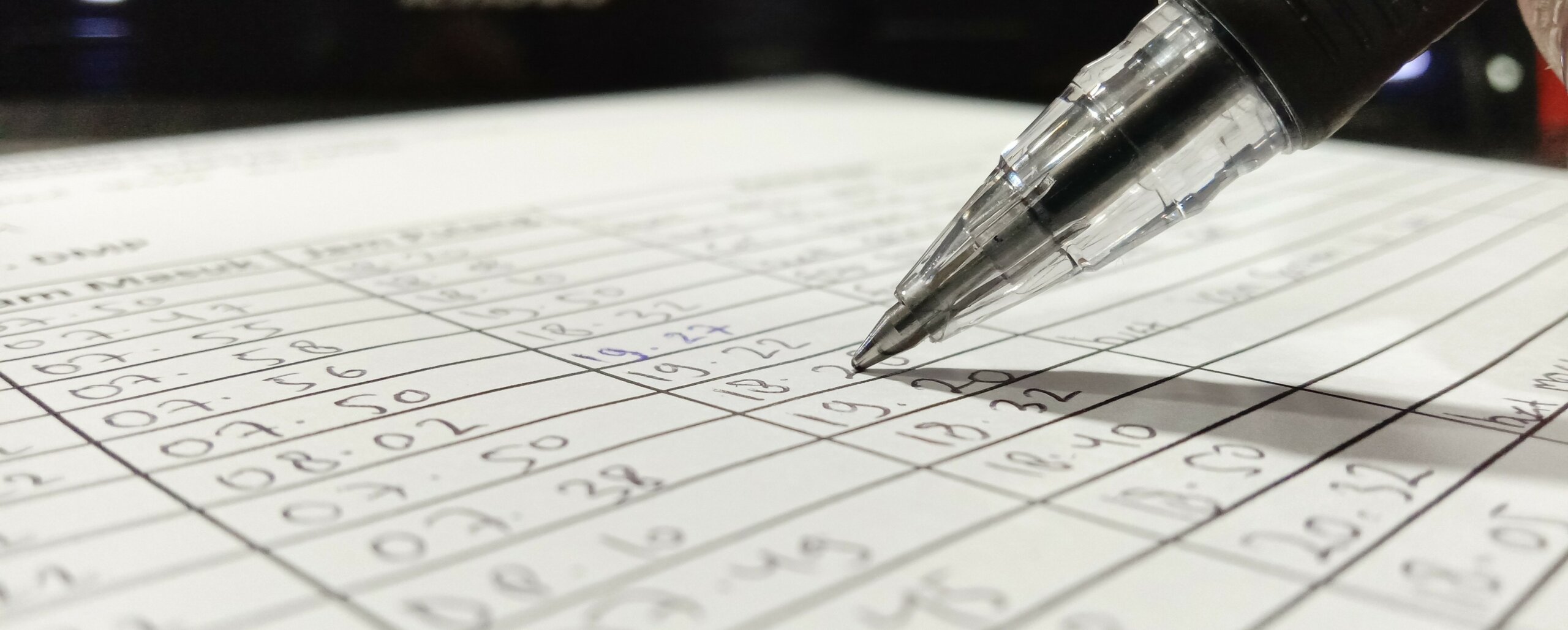 high quality pen writing figures into a table in a page